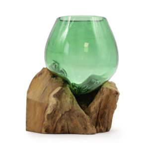 Small bowl made from recycled beer bottles resting on a wooden surface.