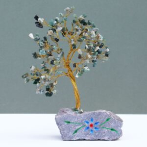 Handmade Moss Agate gemstone tree mounted on a natural rock base.