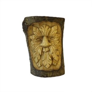 Intriguing tree trunk carving of a Small Green Man for garden decor.