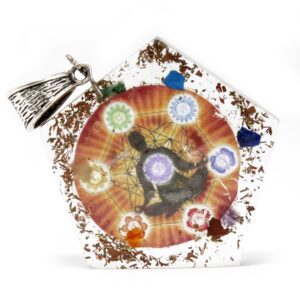 Pentagon-shaped orgonite pendant featuring gemstone chips and copper elements.