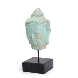 Serene green copper Buddha head on a stand, symbolising mindfulness and calm.