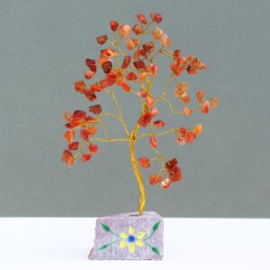 Handmade carnelian gemstone tree mounted on a rock base for home decor.