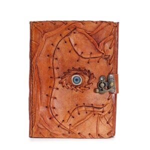 Light brown tan book with evil eye decor and deckle edged pages.