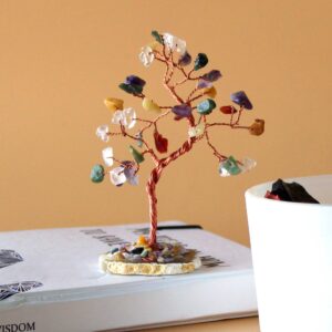 Multi-stone gemstone tree on a natural agate base, showcasing vibrant colours.