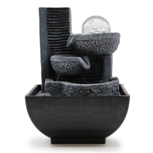 Elegant tabletop water feature with pouring pots for a calming atmosphere.