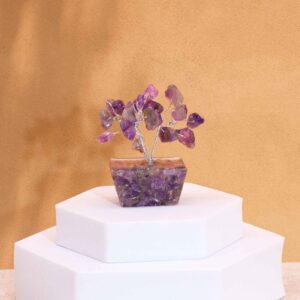 Mini gemstone tree with amethyst stones on an orgonite base, elegantly crafted.
