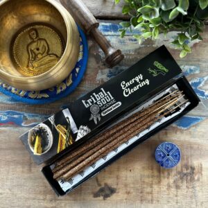Ceramic holder with Tribal Soul incense sticks for energy clearing rituals.