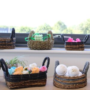 Set of two banana leaf and raffia baskets in a natural style.