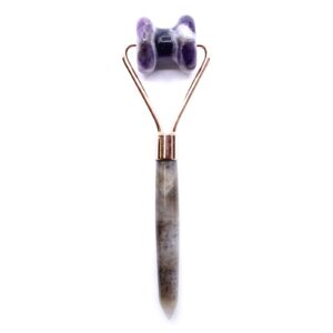 Amethyst jawline roller for facial massage with natural tonal variations.