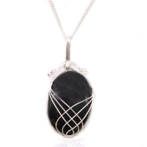 Elegant black onyx gemstone necklace with a swirl design frame.