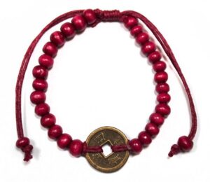 Red Good Luck Feng Shui Bracelet featuring wooden beads and coins of fortune.