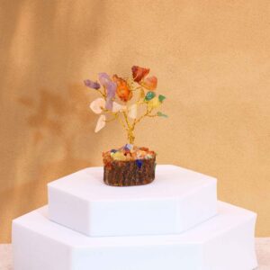Mini gemstone tree with multi-coloured stones on a wooden base.