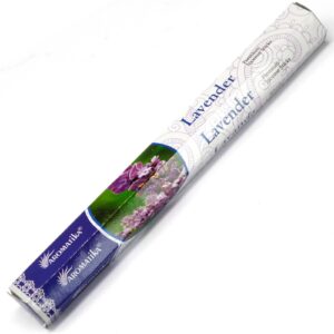 Lavender incense sticks in a decorative holder, creating a calming atmosphere.