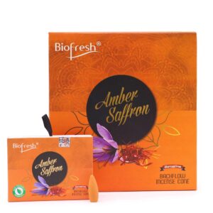 Backflow incense cones with amber and saffron fragrance in a decorative setting.