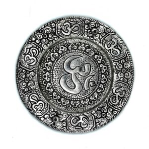 Elegant polished aluminium incense holder with Om symbol for a serene atmosphere.