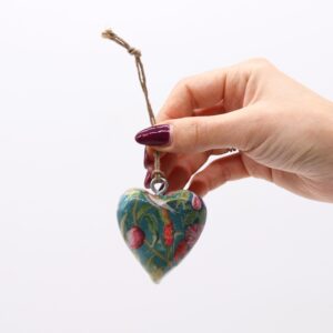 Large wooden heart decor featuring a bird and floral design for home styling.