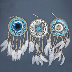 Pastel blue macramé dream catcher with feathers, handmade in Bali.
