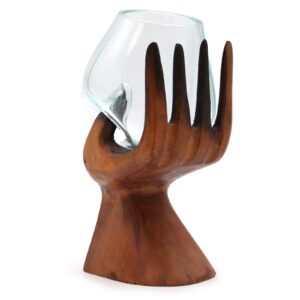 Elegant carved hand sculpture with a molten glass bowl for home decor.