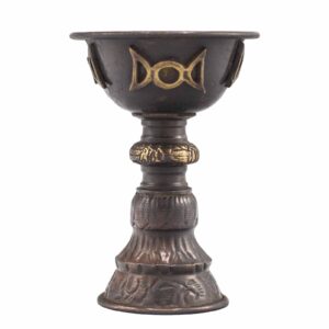 Antique copper goblet featuring a triple moon design, ideal for rituals.