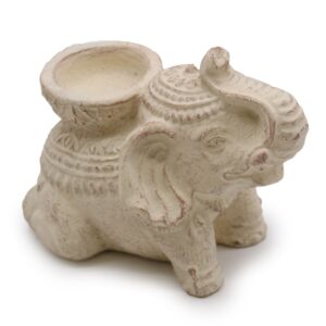 Cream elephant incense and candle holder for a serene atmosphere.