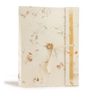 Large notebook with hand-pressed flower petals on the cover, showcasing unique botanical design.