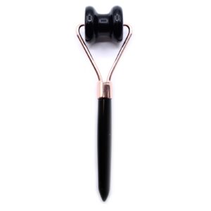 Black obsidian jawline roller designed for facial massage and contouring.