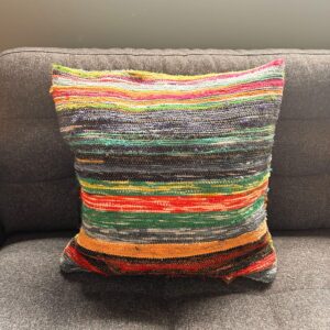 Natural greens rag rug cushion covers adding a boho touch to your home decor.