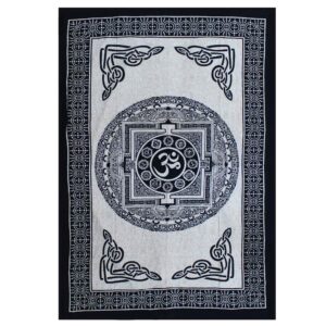 Mono OM Mandala cotton bedspread and wall hanging in a serene setting.