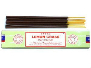 Lemongrass Satya incense sticks in a decorative holder, creating a calming atmosphere.