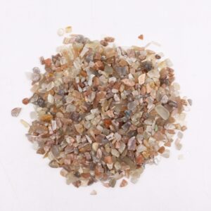 Bulk moonstone gemstone chips in a natural setting for mindful living.