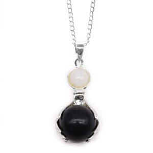 Black Agate Healing Hands pendant showcasing a smooth, elegant design.