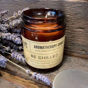 Amber glass jar aromatherapy candle with natural soy wax and essential oils.