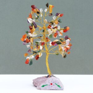 Handmade Indian gemstone tree with vibrant stones on a rock base.