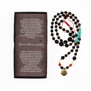 Handcrafted necklace featuring lava stone and vibrant beads with an Om pendant.