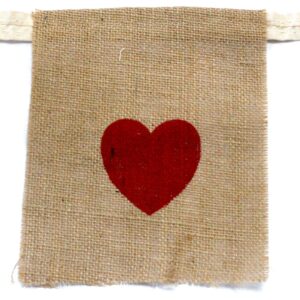 Natural jute bunting with 'I LOVE YOU' and hearts for celebrations.