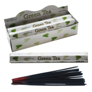 Green Tea Premium Incense sticks in a stylish holder, creating a calming atmosphere.