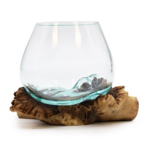 Unique bowl crafted from molten glass on a rare wooden base.