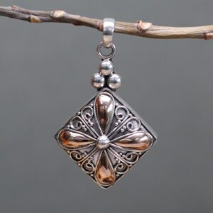 Elegant silver and gold square drop pendant, perfect for thoughtful gifting.