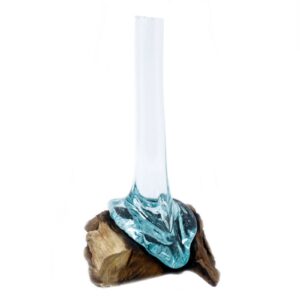 Handmade molten glass vase on wood, showcasing natural elegance and craftsmanship.