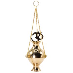 Polished brass incense burner with Om symbol and star-shaped cutouts.