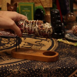 Two hand-rolled Indian sage smudge sticks for purification and energy clearing.