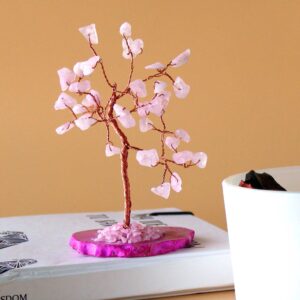 Gemstone tree featuring rose quartz stones on a pink agate base.