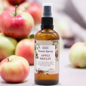 Home Fresh Room Spray in Apple Breeze scent, 100ml bottle on a wooden surface.