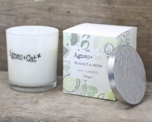 Velvet Moon votive candle in a serene setting, exuding a warm and inviting glow.