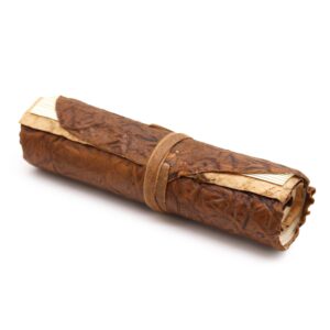 Elegant rolled leather travel notebook with a natural finish and leather strap.