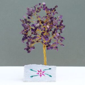 Handmade amethyst gemstone tree mounted on a rock base for home decor.