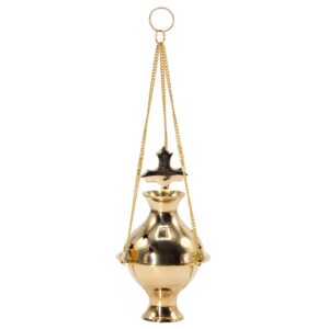 Handmade brass incense burner with cross finial and star cut-outs.