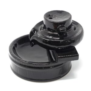 Elegant backflow incense burner creating cascading smoke effect.